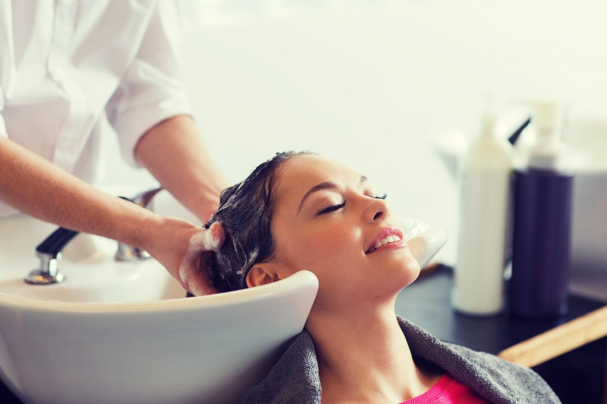 client relaxing at a salon shampoo bowl