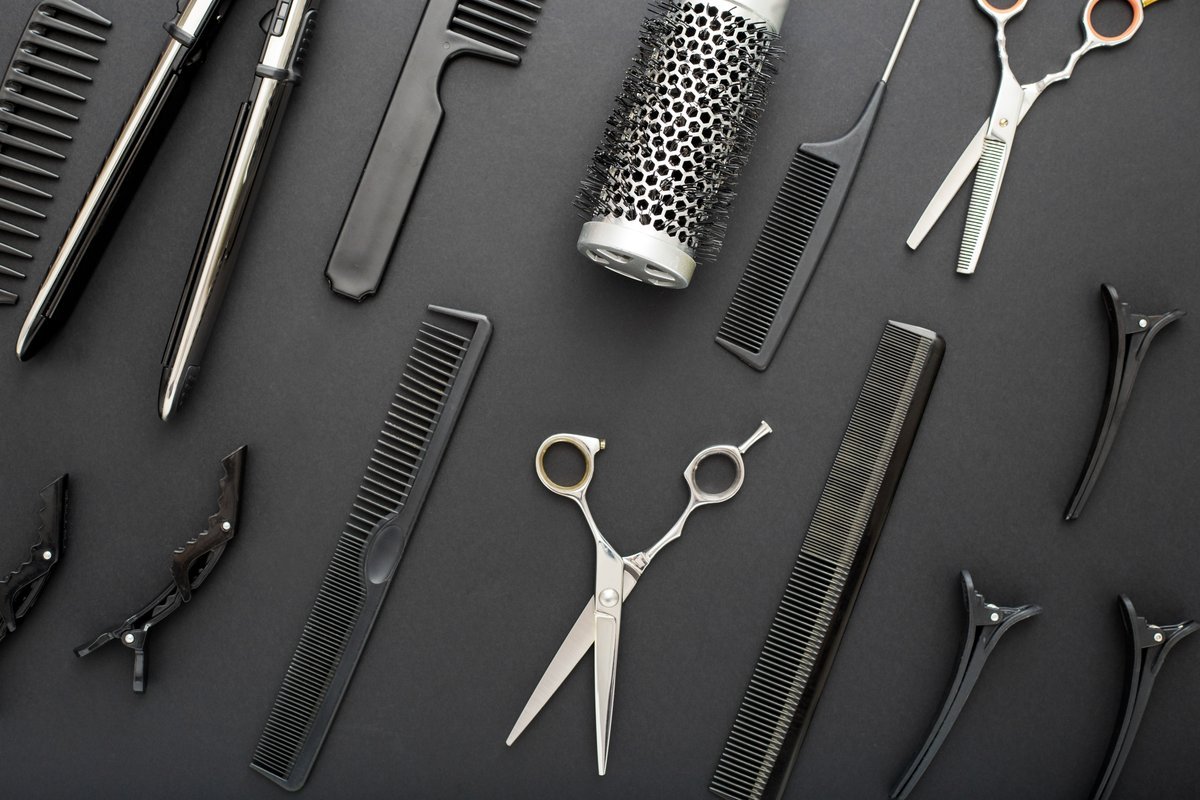 salon tools flatlay with scissors and combs