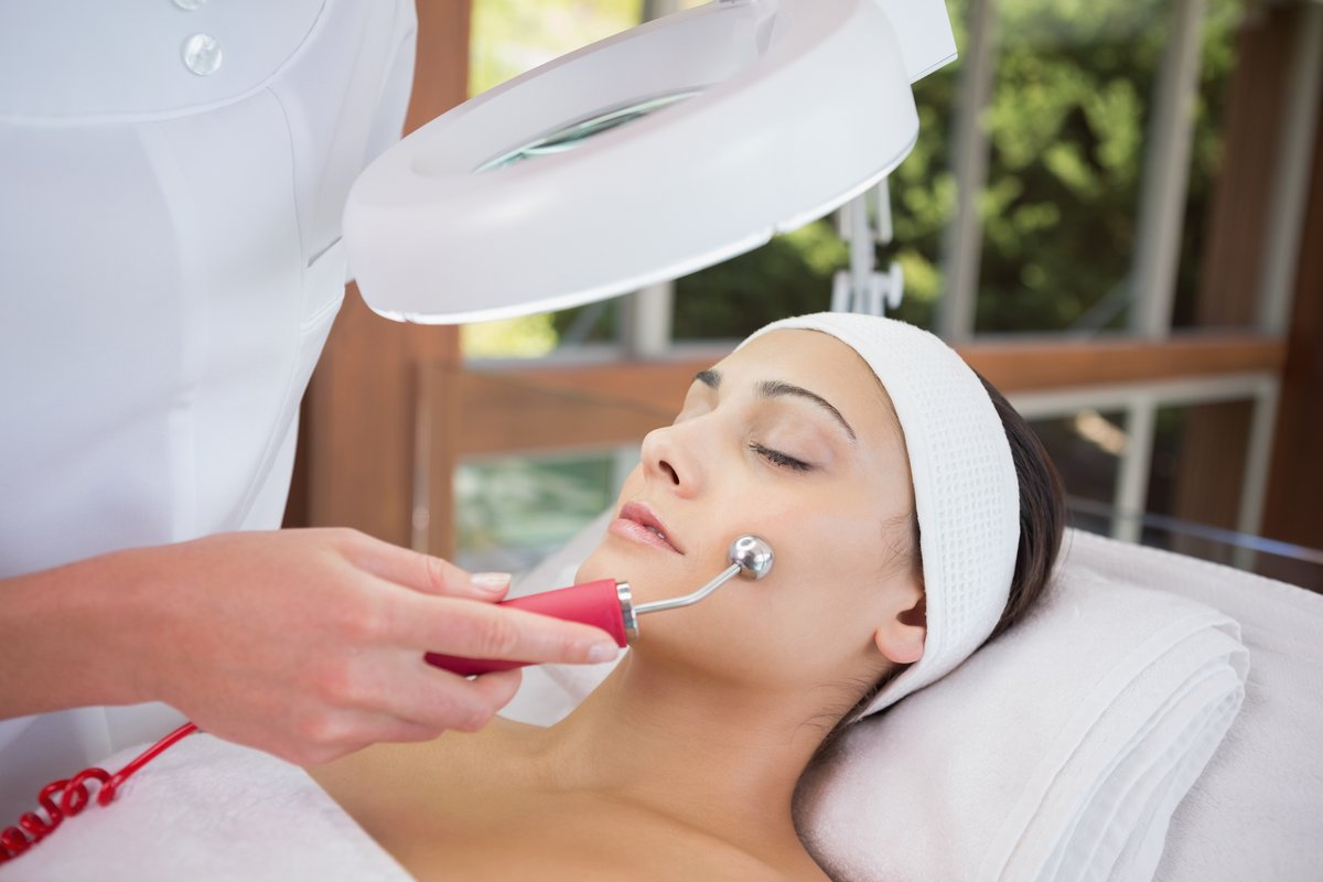 esthetician facial treatment in a skincare studio