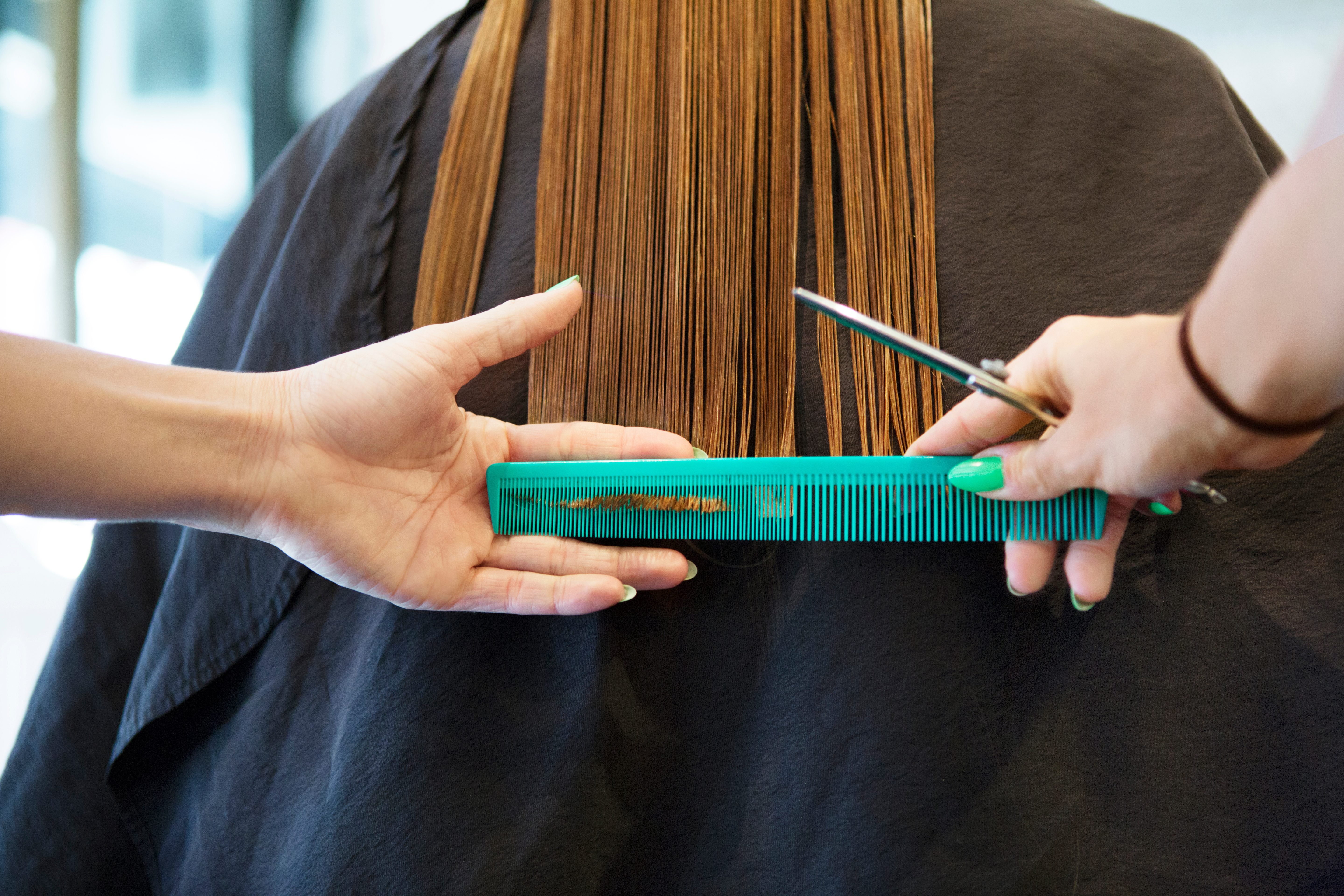 haircut tools with scissors and comb on a salon station